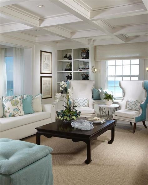 This living room boasts a traditional take on coastal style. The crisp blue and w… | Living room ...