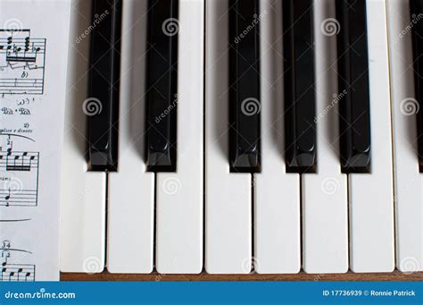 Piano Keyboard And Sheet Music Stock Image - Image of black, keyboard ...