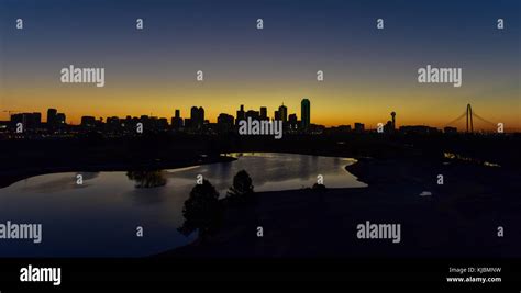 Downtown Dallas skyline at sunrise in Texas, USA from the Trinity River ...