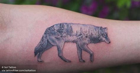 Double exposure winter wolf tattoo on the left inner