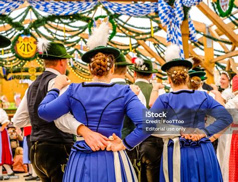 Bavarian Traditional Dancers At A Beertent Stock Photo - Download Image Now - Agricultural Fair ...