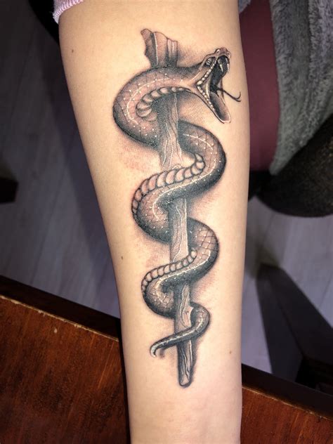 The rod of Asclepius | Tatoeage