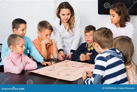 Boys and Little Girls Playing at Board Game Stock Photo - Image of ...