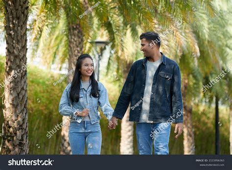 Cheerful Boyfriend Girlfriend Holding Hands Looking Stock Photo ...