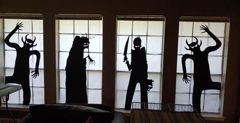 Made these window silhouettes for my family room windows. Covered windows in wax paper and will ...