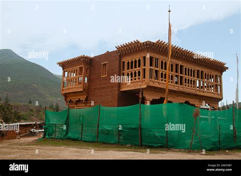 Traditional Bhutaneese house under constuction, Punakha Dzong in Bhutan Stock Photo - Alamy