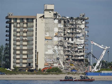 A Miami building is evacuated near the site of the deadly Surfside condo collapse : NPR