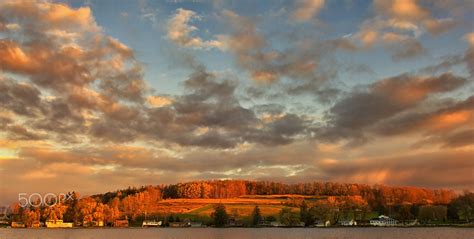 Hilltop Sunrise - The dawn light pops through the clouds and lights up the hills and sky with ...