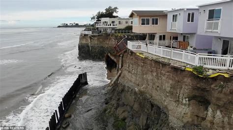 Storm topples homes off cliffs with nine dead in California