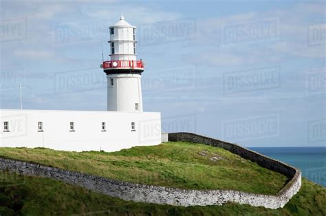 Galley head lighthouse, near awnehincha;County cork, ireland - Stock Photo - Dissolve