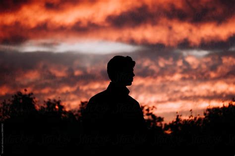 "Man's Silhouette Against Sunset" by Stocksy Contributor "Vera Lair" - Stocksy