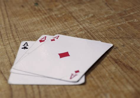 Three Aces Cards On Wooden Table | Copyright-free photo (by M. Vorel) | LibreShot