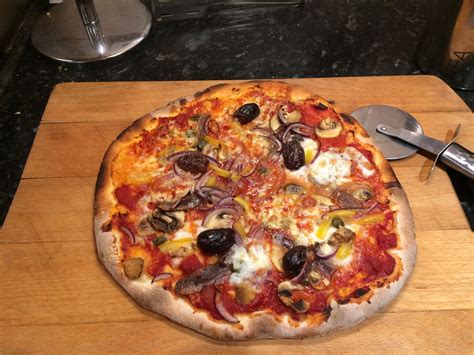 Homemade Pizza with anchovies, olives, mushrooms and capers : r/Pizza