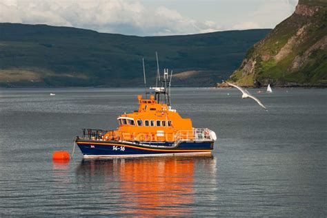 United Kingdom, Scotland, Highland, Portree, Portree Port, orange ship and flying seagull — flag ...