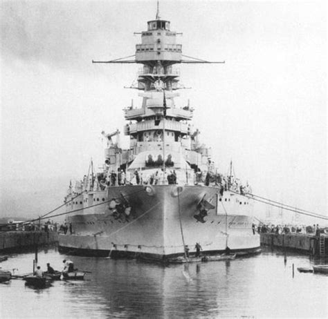 an old photo of a large ship in the water with people standing on it's deck