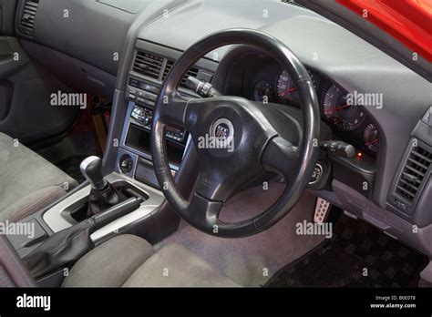 steering wheel, dash and facia region in the interior of a Nissan R33 GT-R Skyline car Stock ...