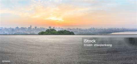 City Skyline And Buildings With Empty Asphalt Road At Sunrise Stock Photo - Download Image Now ...