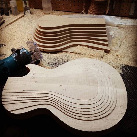 Carving the top #guitarmaker #guitarmaking #madeincanada #woodworking # ...