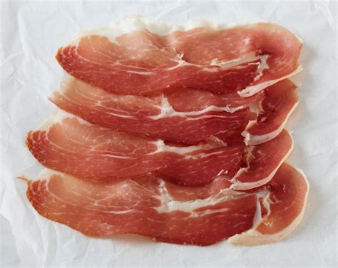 Prosciutto is an Italian dry-cured ham that is usually thinly sliced and served uncooked; this ...