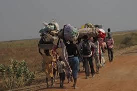 People walking through the desert.