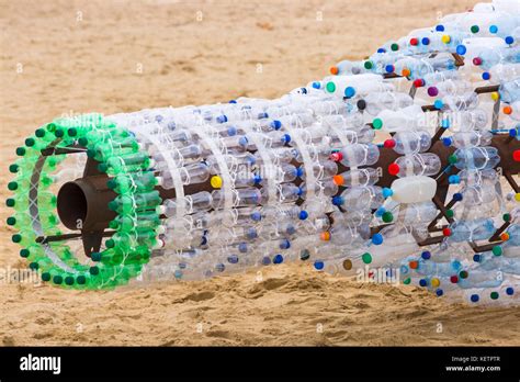 Upcycling plastic bottles at Bournemouth beach - part of Save our Stock Photo: 164043287 - Alamy