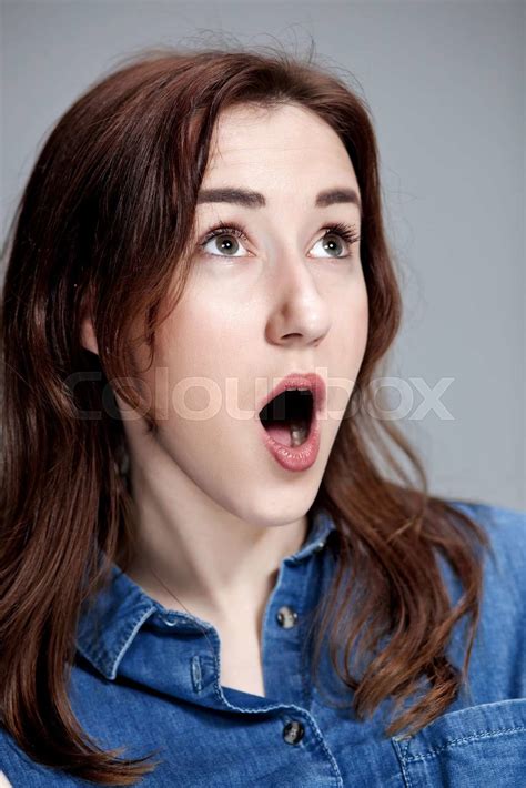 Portrait of young woman with shocked facial expression | Stock image ...