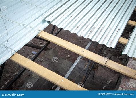 Installation of Sheets of Metal Tiles of Roof Stock Photo - Image of building, design: 250950352