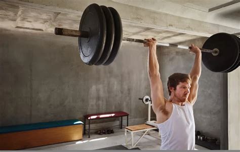 Man lifting heavy weigths — Stock Photo © mavoimages #105573834