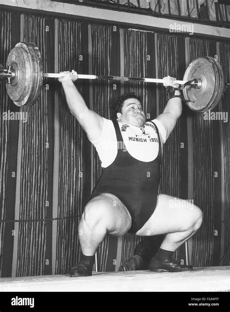 Paul Anderson lifts 320 pounds during the 1955 weightlifting World ...