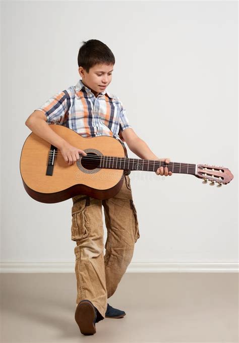 Boy is Playing the Acoustic Guitar on White Background Stock Image - Image of child, instrument ...