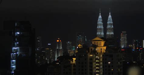 Kuala Lumpur night view and woman with pad in pool 28897826 Stock Video ...