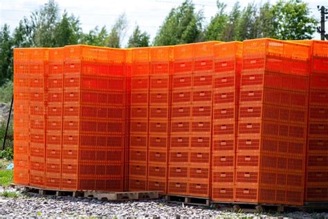 Premium Photo | A stack of orange bins with the word " orange " on the ...