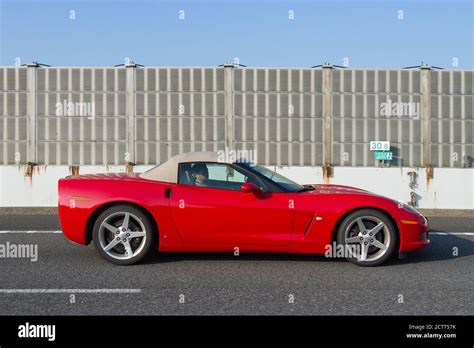 A 2006 C6 red Chevrolet Corvette. convertible on a road Yamanashi ...