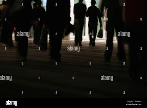 crowd of people walking in street at night Stock Photo - Alamy