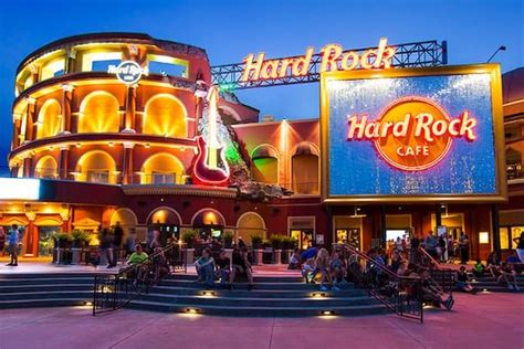 The exterior of Hard Rock Cafe with its illuminated sign at Universal ...