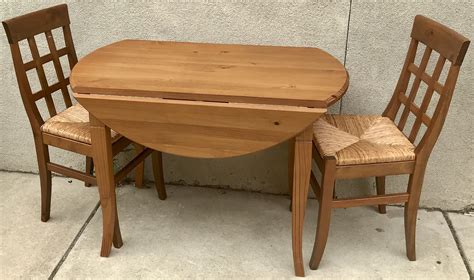 Uhuru Furniture & Collectibles: Pine Drop Leaf Table & 2 Chairs with Woven Wicker Seats - $165 SOLD