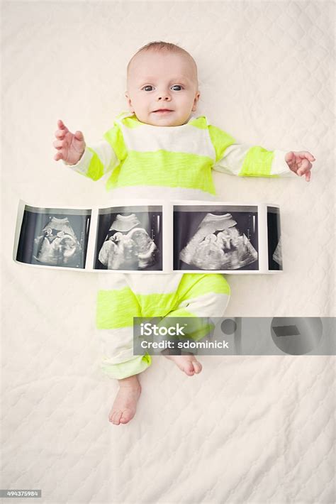 Three Month Old Baby Boy With His Ultrasound Photos Stock Photo - Download Image Now - iStock