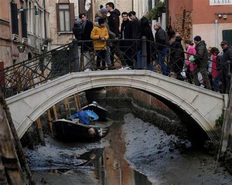 Drought And Low Tides Cause Venetian Canals To Run Dry