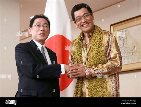 Japanese comedian Pikotaro, right, and Japanese Foreign Minister Fumio ...