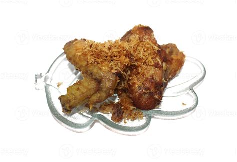 Ayam Serundeng, Fried Chicken with Shredded Coconut. 17176524 Stock Photo at Vecteezy