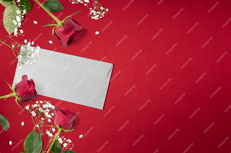 Premium Photo | Roses background with love letter and white decorative flowers with copy space ...