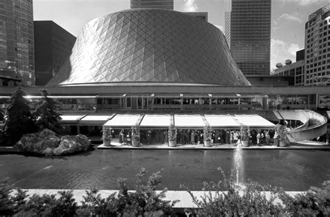 a large building with a fountain in front of it