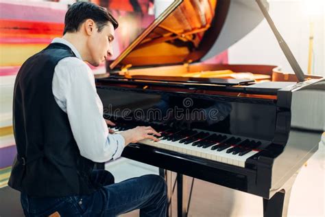 Male Pianist at the Classical Black Grand Piano Stock Image - Image of ...