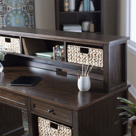 a wooden desk with drawers and baskets on it