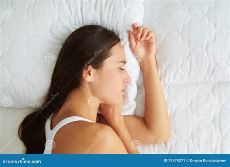 Woman Sleeping While Lying In Bed Stock Photo | CartoonDealer.com #92626992