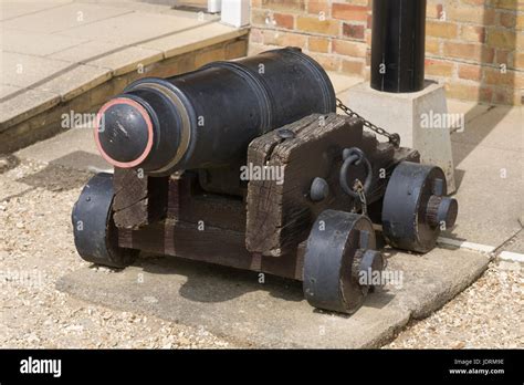 Cannon on display outside museum at Buckler's Hard in New Forest Stock Photo - Alamy