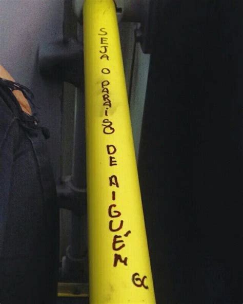 a close up of a yellow baseball bat with writing on it