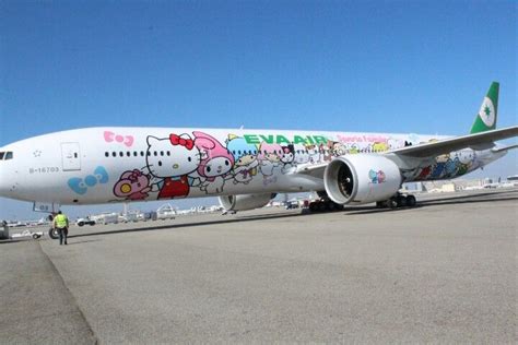 an airplane with hello kitty painted on it's side is parked at the airport