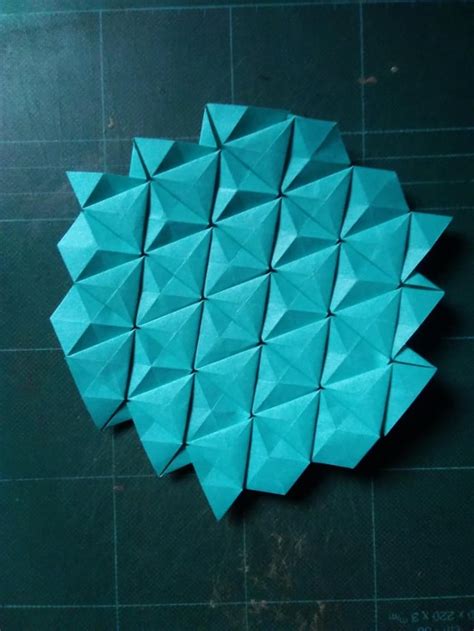 A simple equilateral triangle tessellation with iso-area symmetry : r/origami