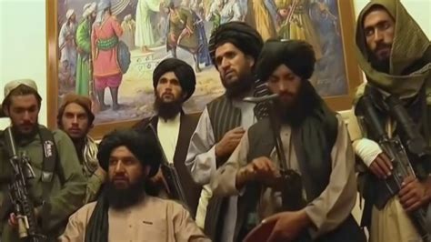 Taliban fighters celebrate inside Afghanistan presidential palace